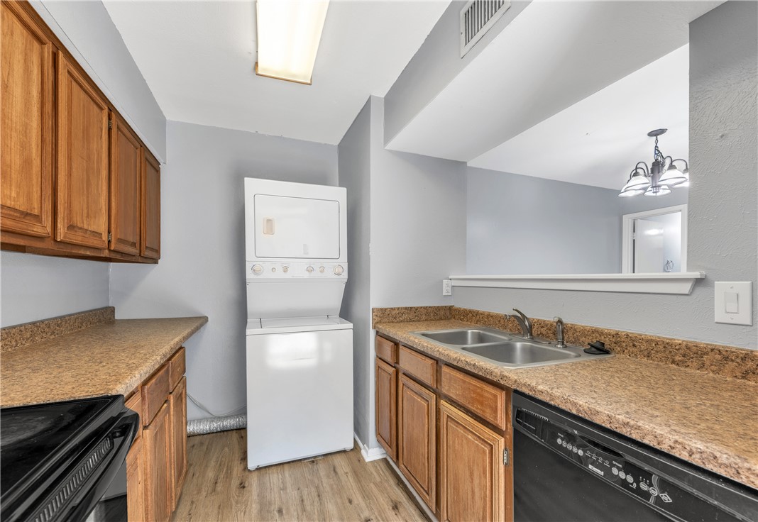 2101 Barak Lane, Unit 17 Bryan, TX 77802 - Photo 11 of 19 a kitchen with a sink stove and cabinets