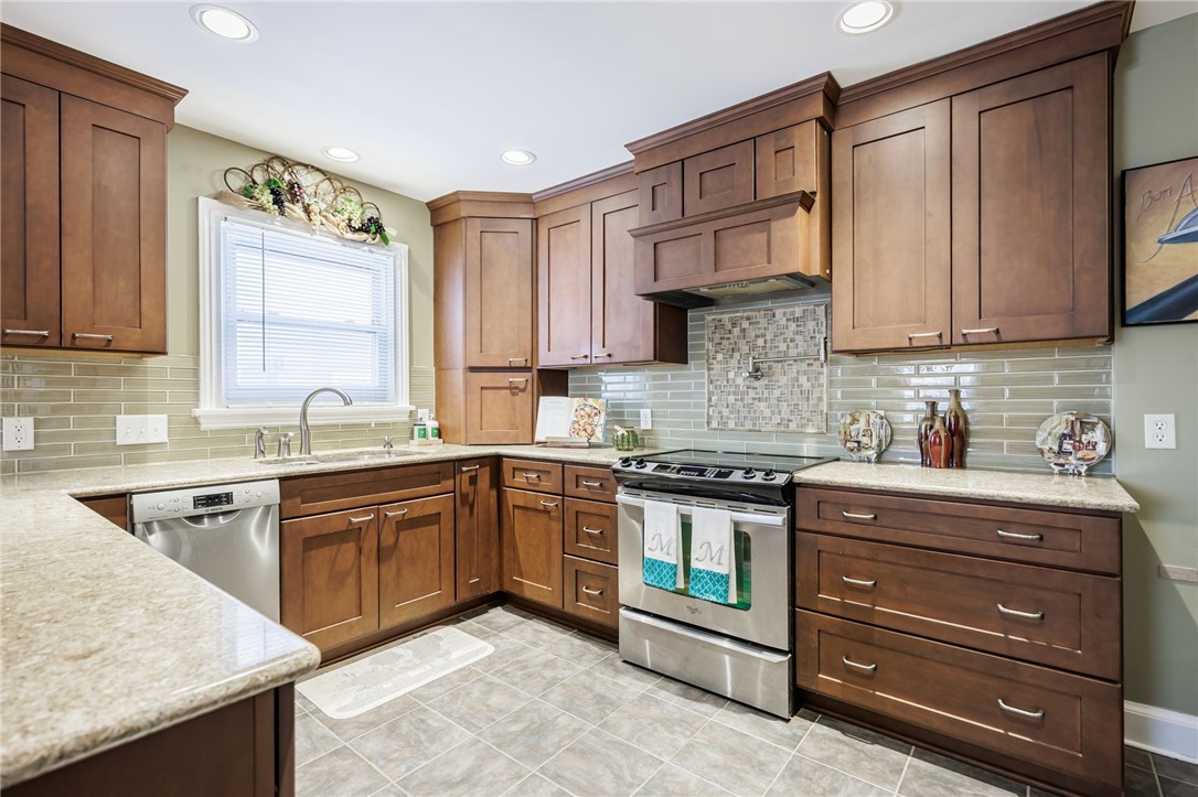 483 Oakwood Road Greece, NY 14616 - Photo 10 of 36 Beautifully Updated Kitchen features updated cabin