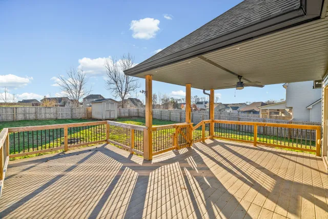 a view of a balcony with wooden floor