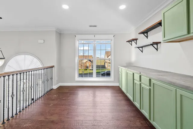 a view of entryway with wooden floor