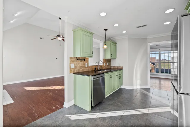 a kitchen with a sink cabinets and window