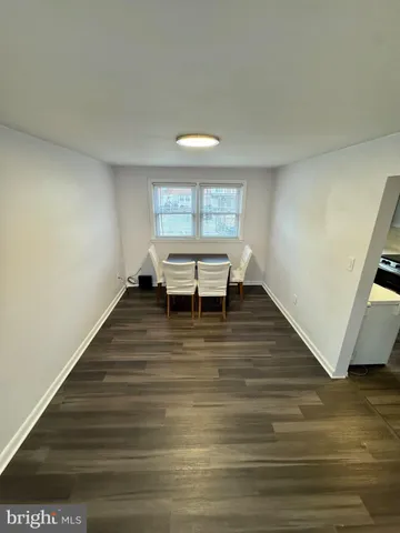 a room with wooden floor and a table