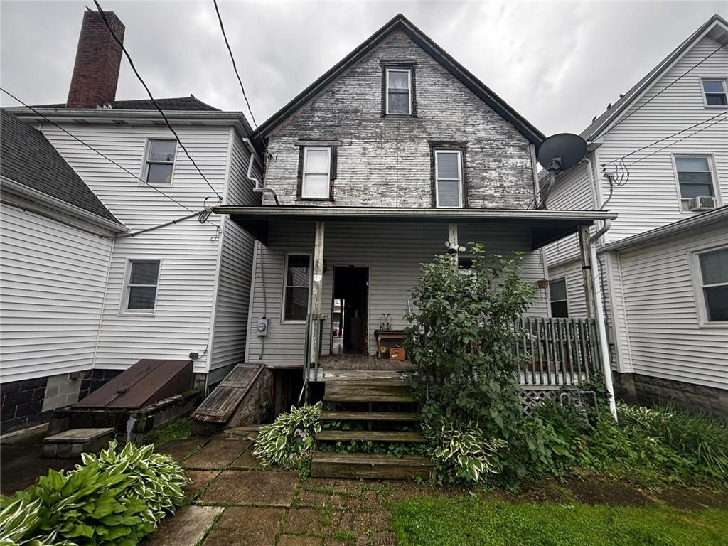 135 Hamilton Avenue Vandergrift, PA 15690 - Photo 24 of 25 a front view of a house with a yard