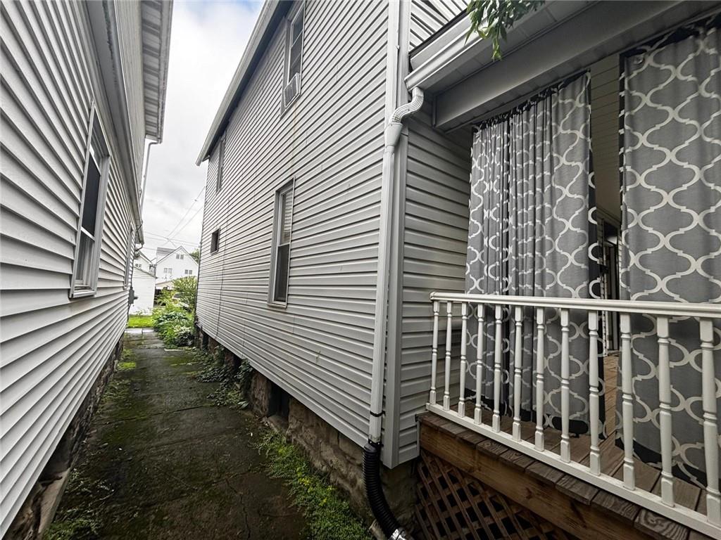 135 Hamilton Avenue Vandergrift, PA 15690 - Photo 3 of 25 a view of a balcony with wooden floor
