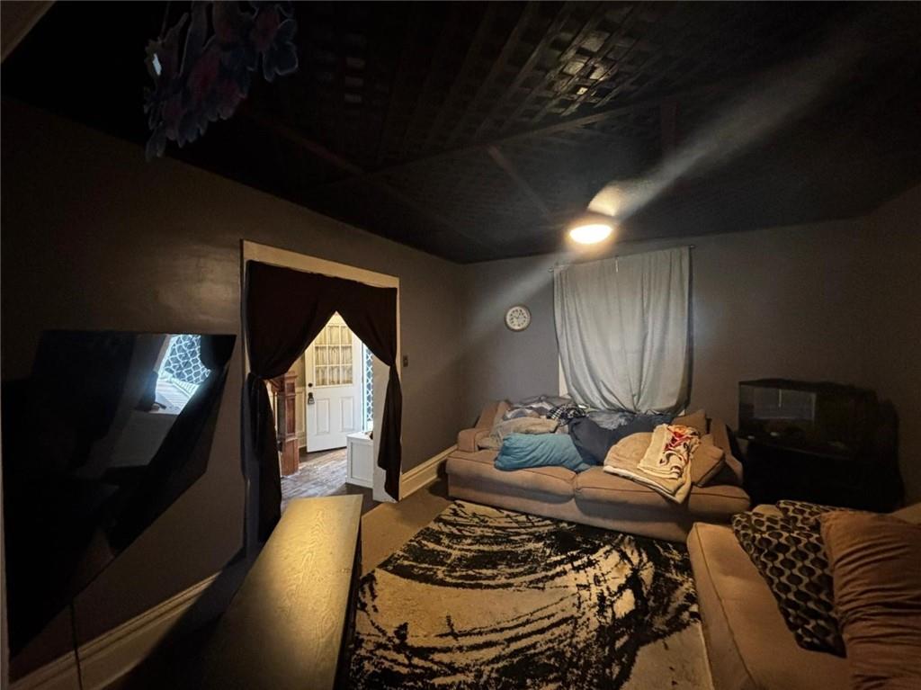 135 Hamilton Avenue Vandergrift, PA 15690 - Photo 5 of 25 a living room with furniture and a fireplace