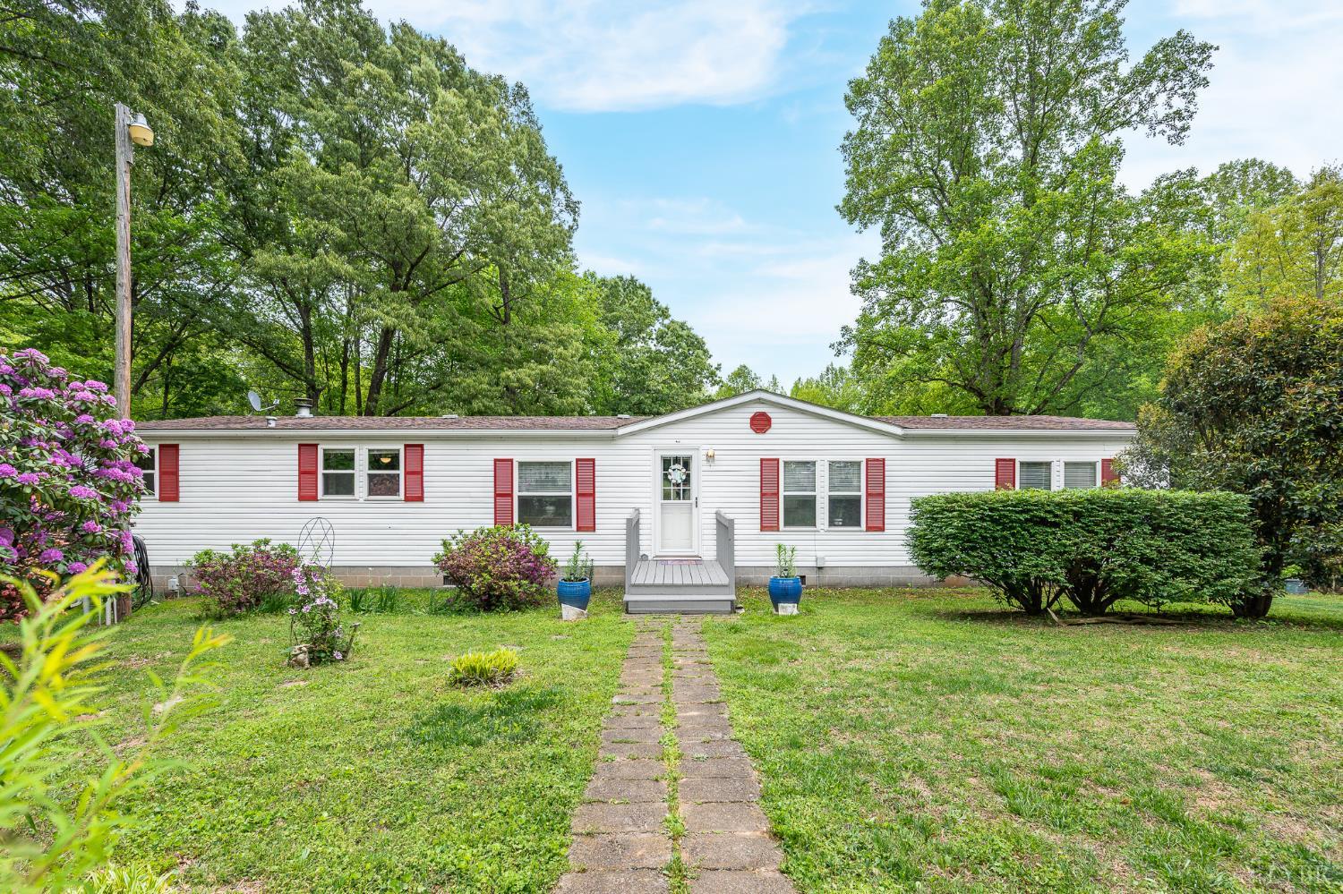 142 Micklem Lane Shipman, VA 22971 - Photo 1 of 38 a front view of a house with garden