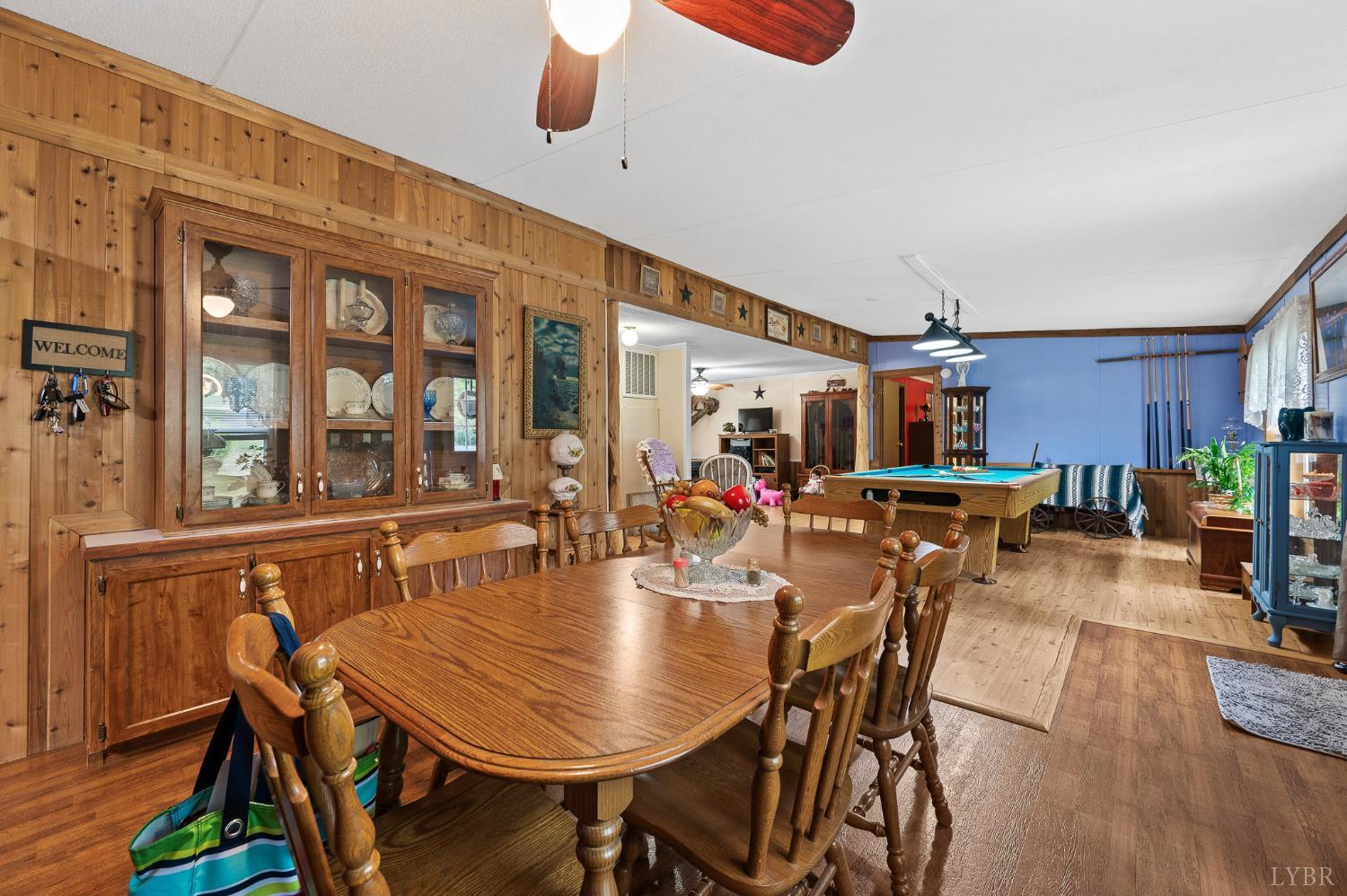 142 Micklem Lane Shipman, VA 22971 - Photo 16 of 38 a dining room with furniture a wooden floor and chandelier