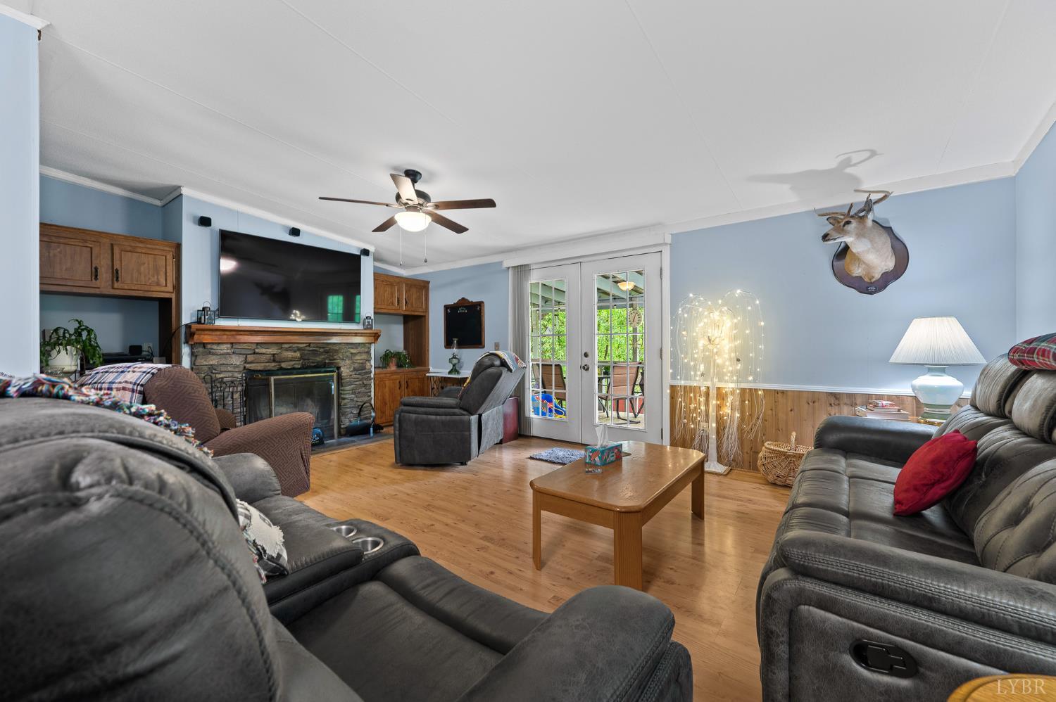 142 Micklem Lane Shipman, VA 22971 - Photo 17 of 38 a living room with furniture a flat screen tv and a fireplace