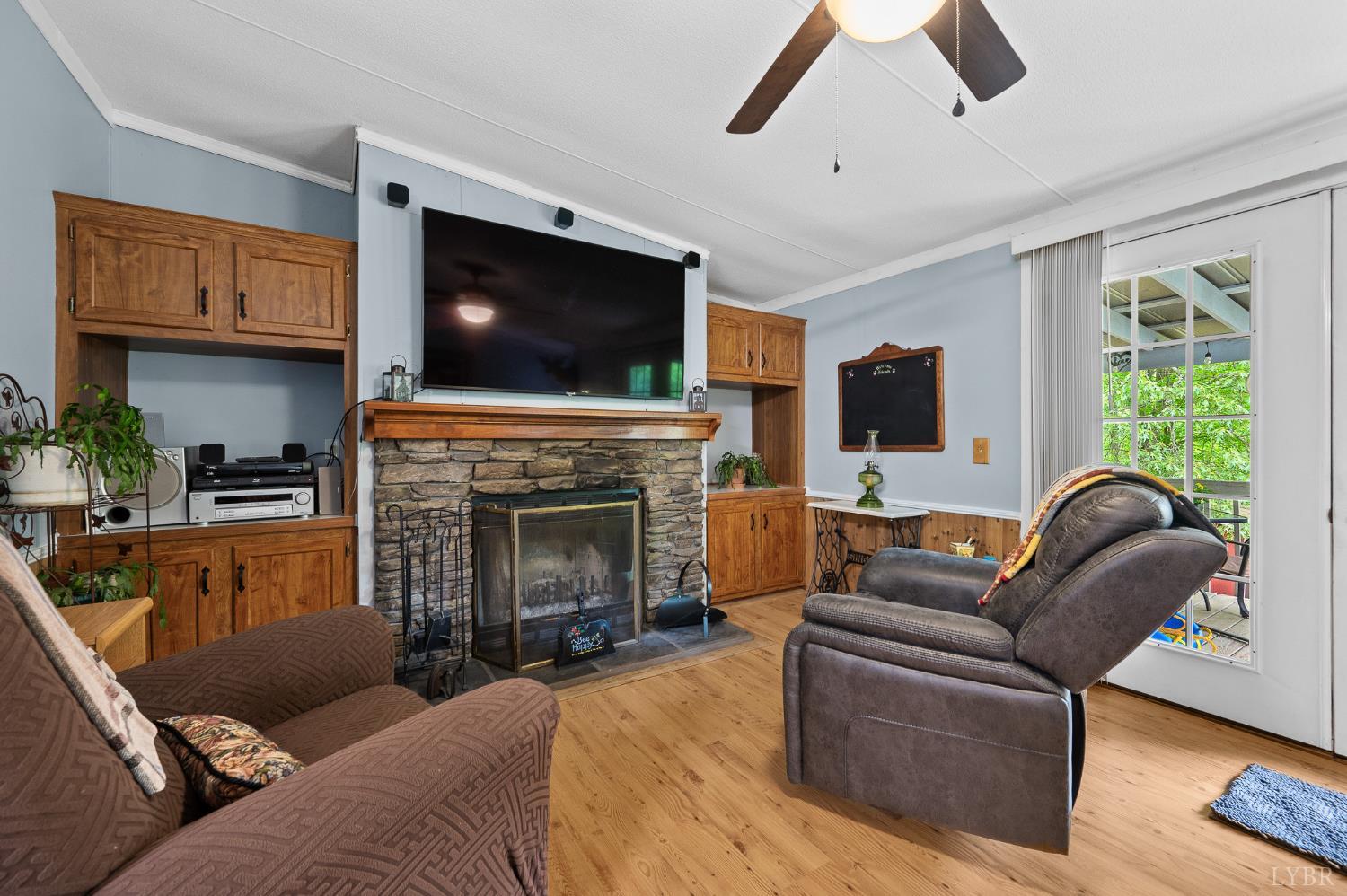 142 Micklem Lane Shipman, VA 22971 - Photo 19 of 38 a living room with furniture a fireplace and a flat screen tv