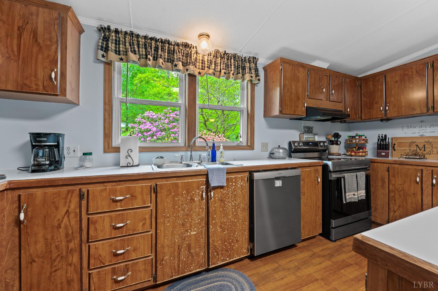 142 Micklem Lane Shipman, VA 22971 - Photo 21 of 38 a kitchen with stainless steel appliances granite countertop a sink a stove and cabinets
