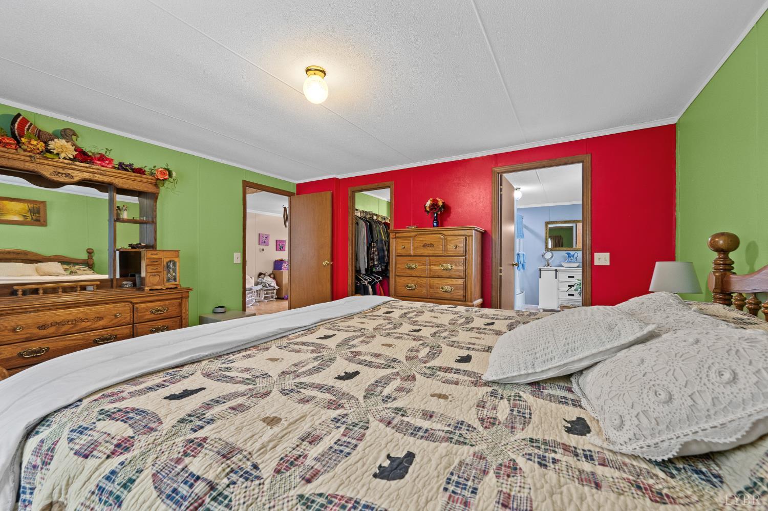 142 Micklem Lane Shipman, VA 22971 - Photo 24 of 38 a bed room with a bed and a dresser