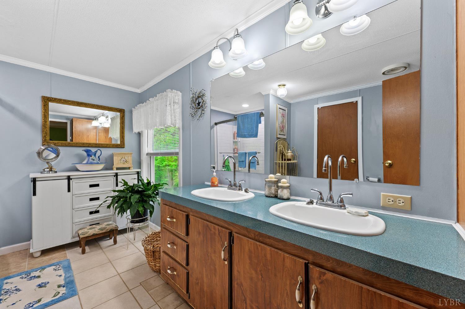 142 Micklem Lane Shipman, VA 22971 - Photo 26 of 38 a bathroom with a sink double vanity and a mirror