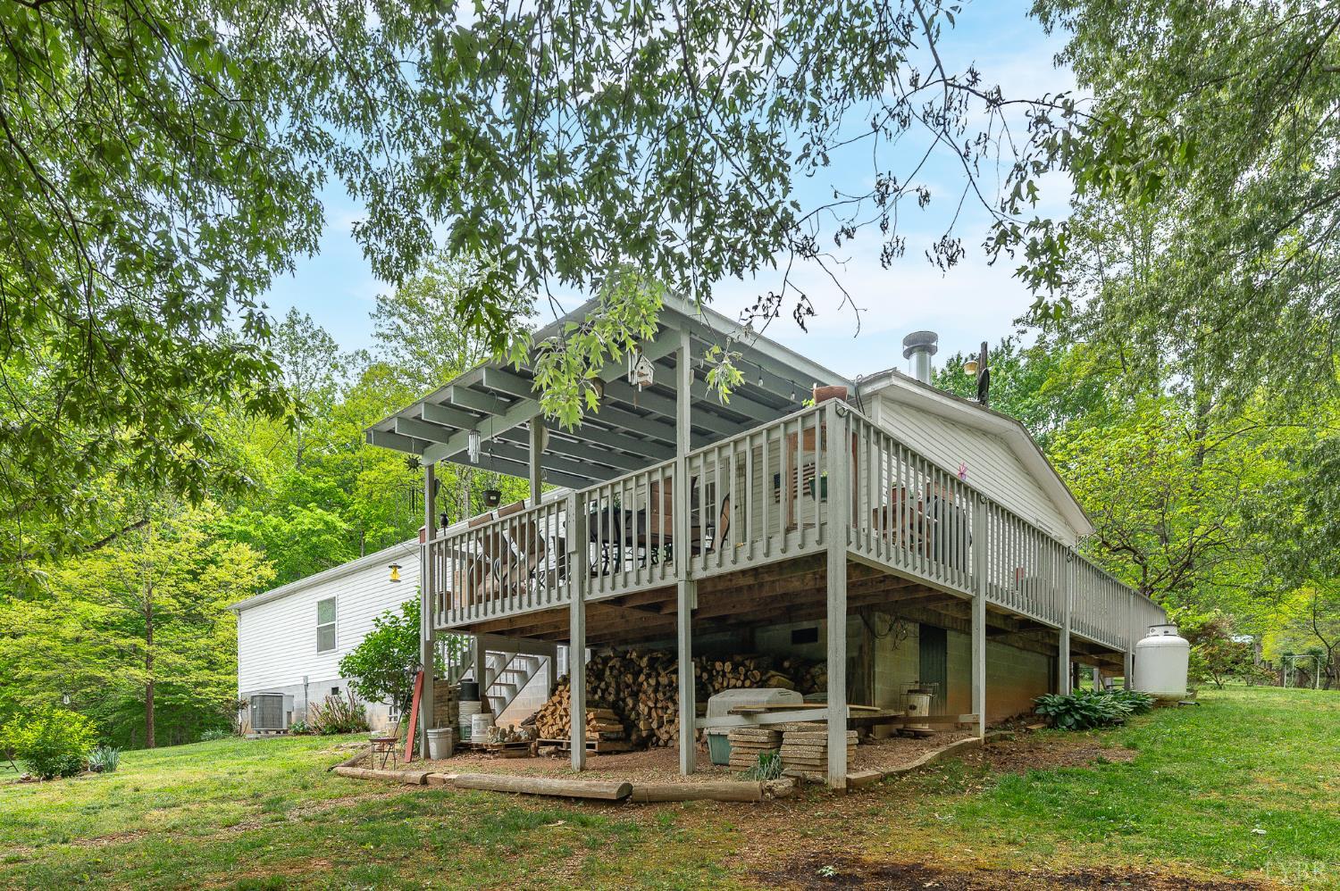 142 Micklem Lane Shipman, VA 22971 - Photo 28 of 38 a view of a house with backyard porch and sitting area