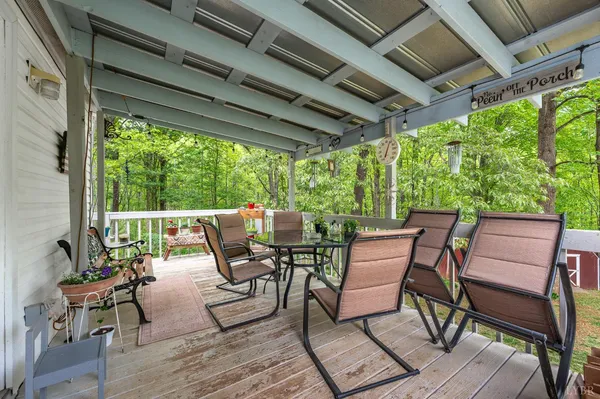a view of a patio with table and chairs