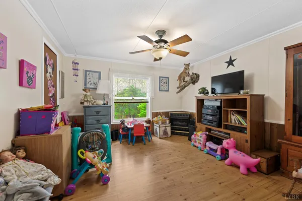 a children room with toys and a flat screen tv