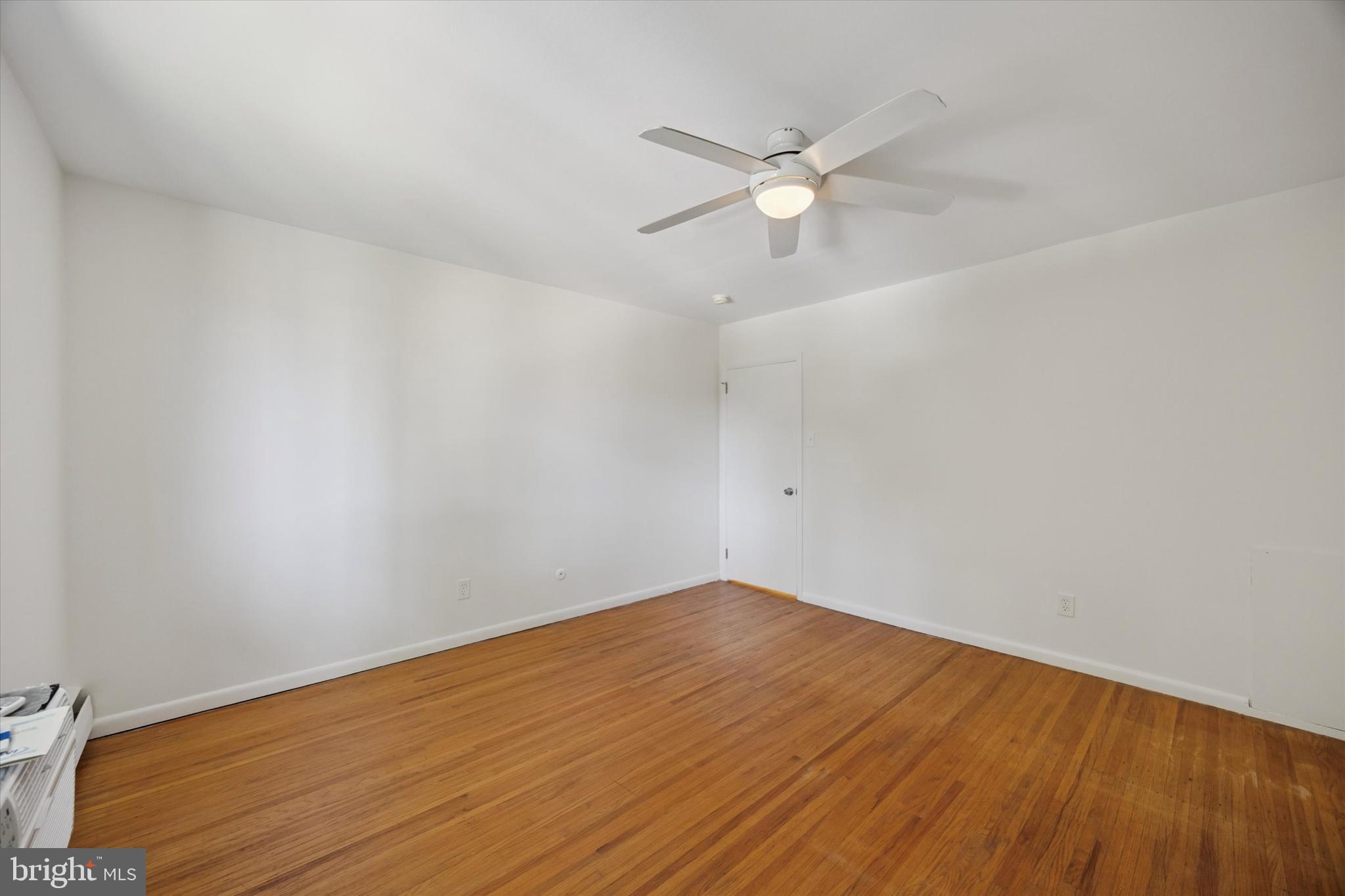 1600 Church Road, Unit A306 Wyncote, PA 19095 - Photo 11 of 15 a view of an empty room with wooden floor