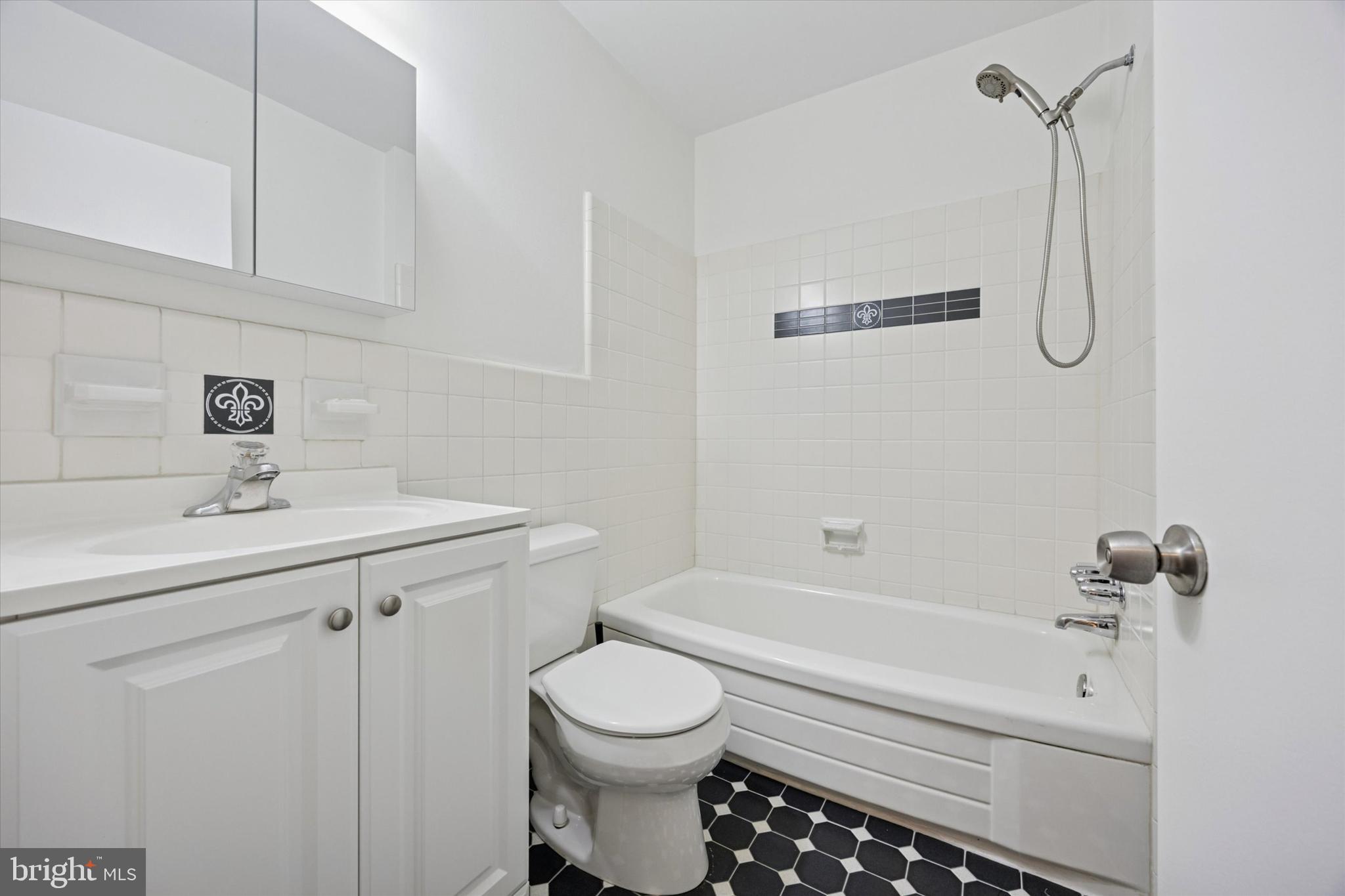 1600 Church Road, Unit A306 Wyncote, PA 19095 - Photo 13 of 15 a bathroom with a sink toilet and shower