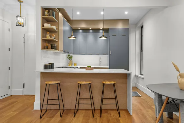 a bathroom with a sink a mirror and a shower