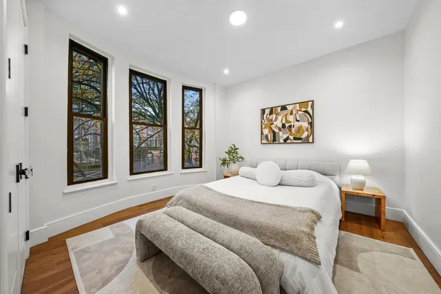 a bedroom with furniture and a window