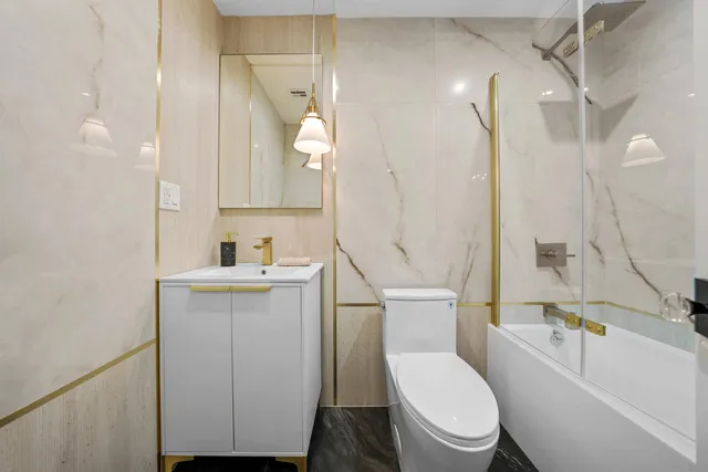 a bedroom with furniture and a large window