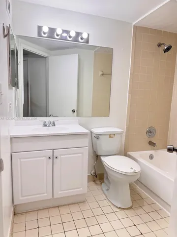 a bathroom with a sink toilet and mirror