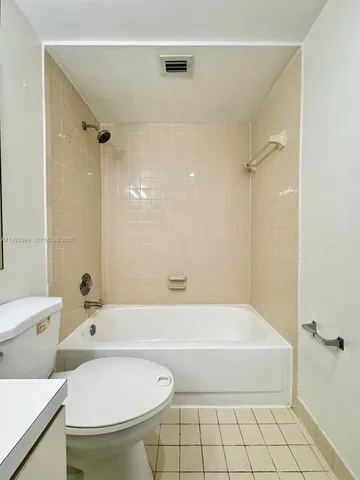 a bathroom with a bathtub and a toilet