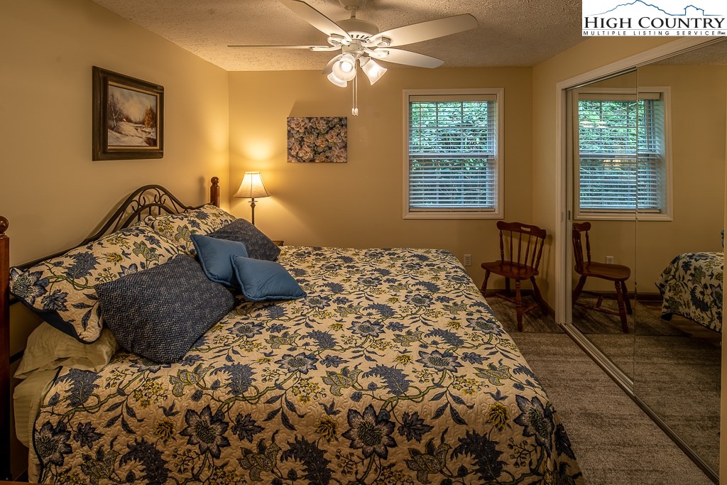 10 Overlook Road Newland, NC 28657 - Photo 26 of 50 a bed sitting in a bedroom next to a window