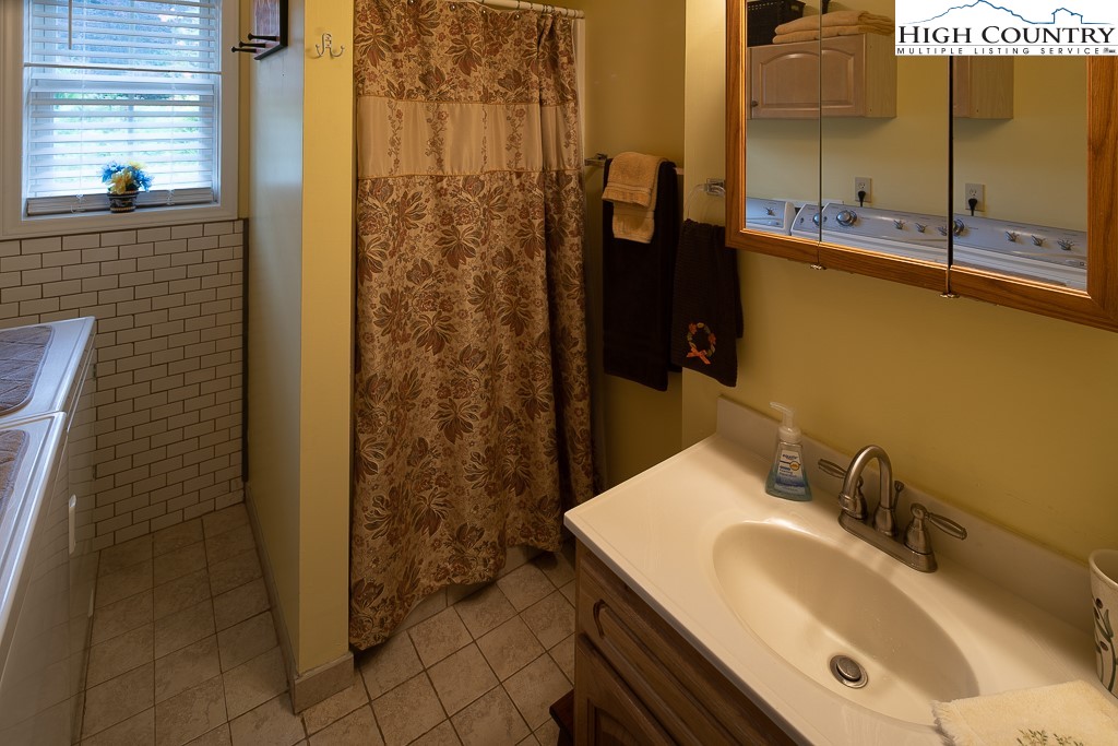 10 Overlook Road Newland, NC 28657 - Photo 30 of 50 a bathroom with a sink and a mirror