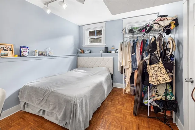 a bed room with a bed and a walk in closet