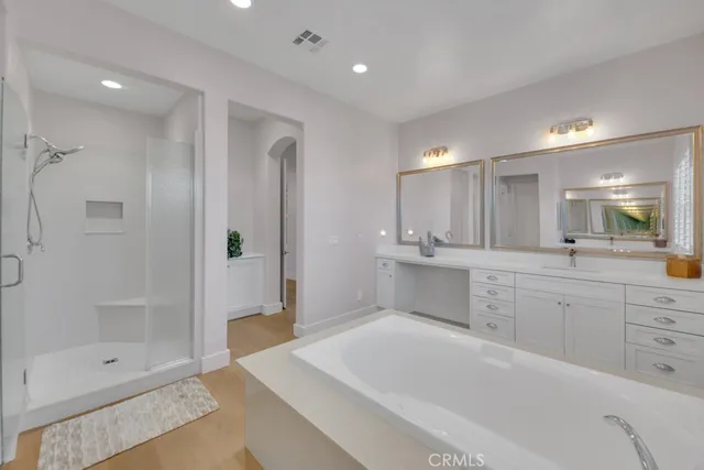 a large bathroom with a glass shower door