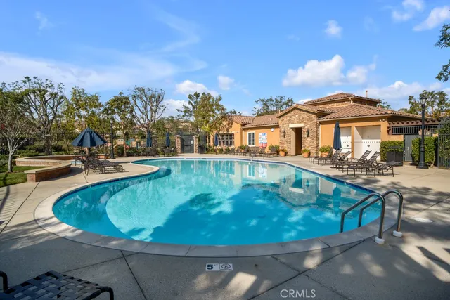 a view of a swimming pool with a patio