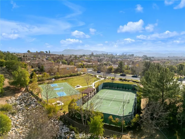 a view of a swimming pool with a table and chairs