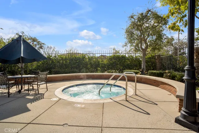 a view of a swimming pool with a patio