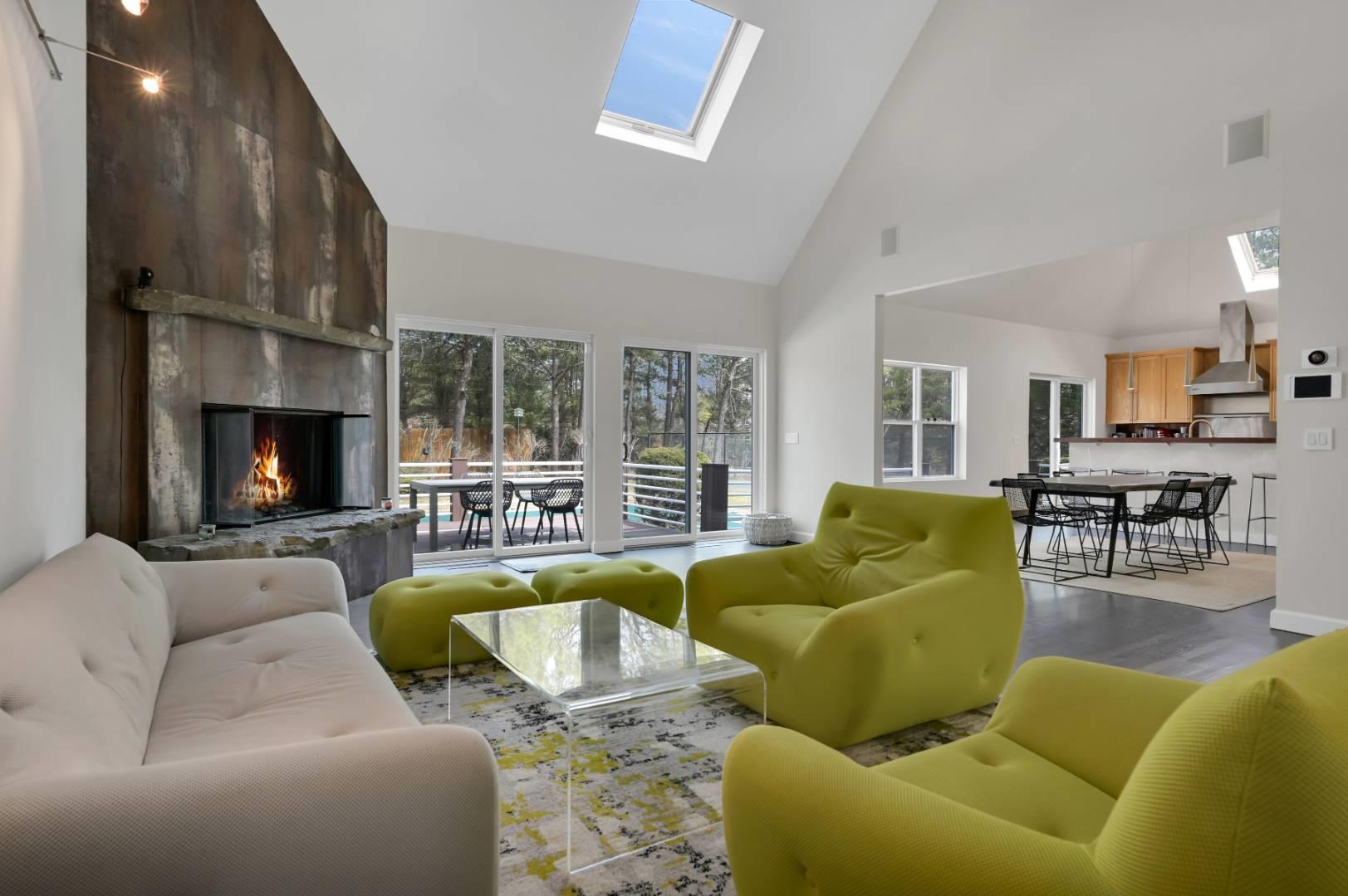 26 Lakeside Lane Westhampton, NY 11977 - Photo 1 of 24 a living room with furniture fireplace and a large window