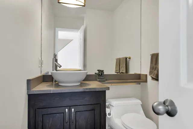 a bathroom with a toilet and a sink