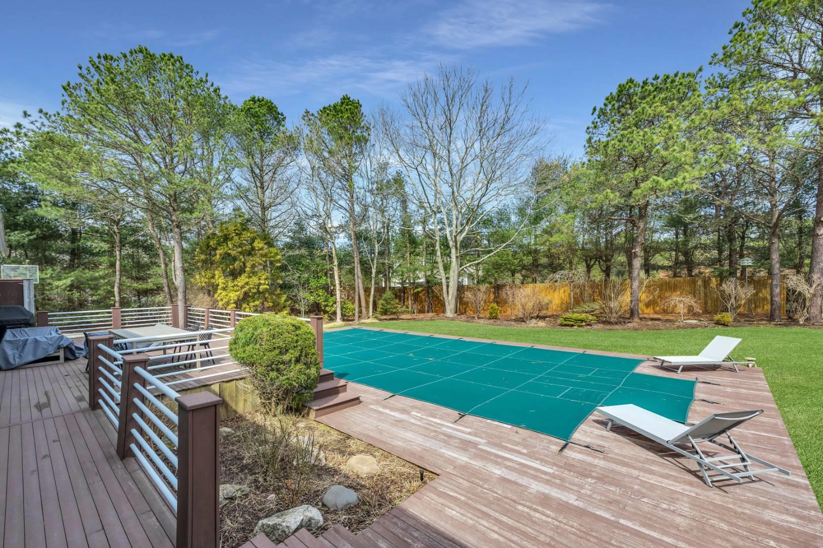26 Lakeside Lane Westhampton, NY 11977 - Photo 15 of 24 a view of a patio with table and chairs potted plants and large tree