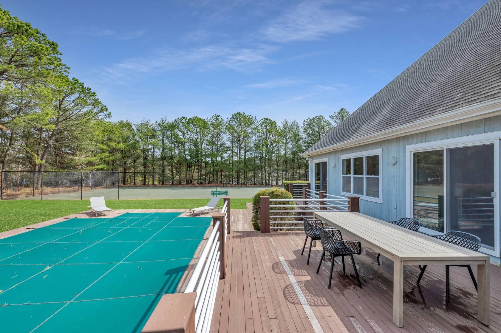 26 Lakeside Lane Westhampton, NY 11977 - Photo 20 of 24 a view of a patio with a table and chairs