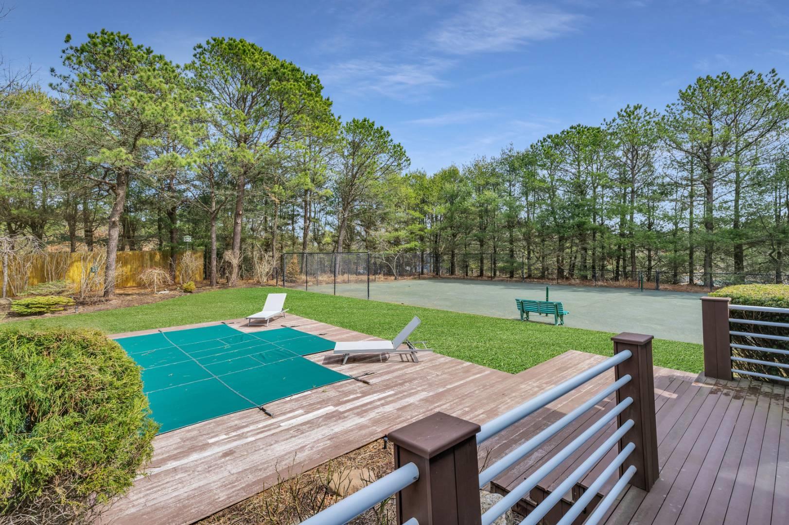 26 Lakeside Lane Westhampton, NY 11977 - Photo 3 of 24 a view of backyard with seating area and green space