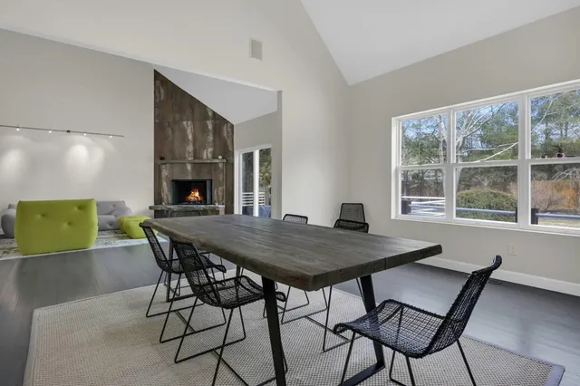 a view of a dining room with furniture window and outside view