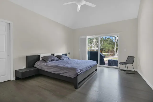 a bedroom with a bed and a chair