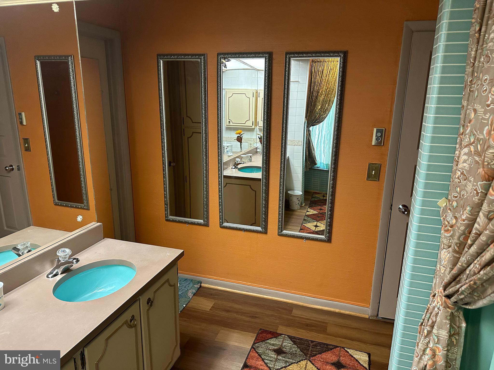 600 Glenside Road Millville, NJ 08332 - Photo 14 of 61 a bathroom with a sink vanity and a mirror