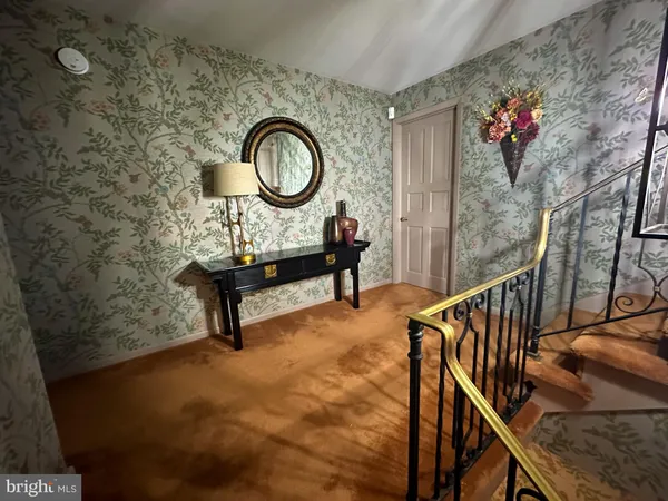 a kitchen with a sink a stove and chairs