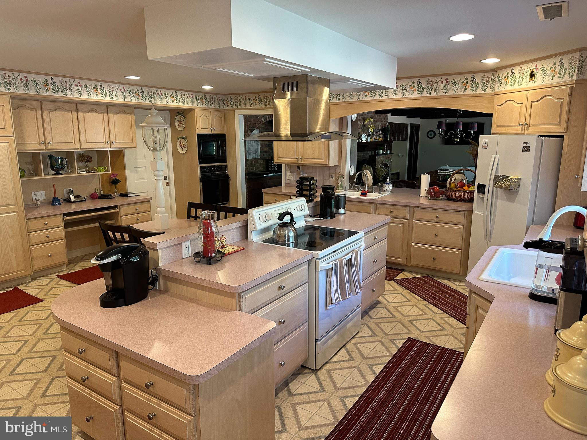 600 Glenside Road Millville, NJ 08332 - Photo 18 of 61 a kitchen with a sink a stove and chairs