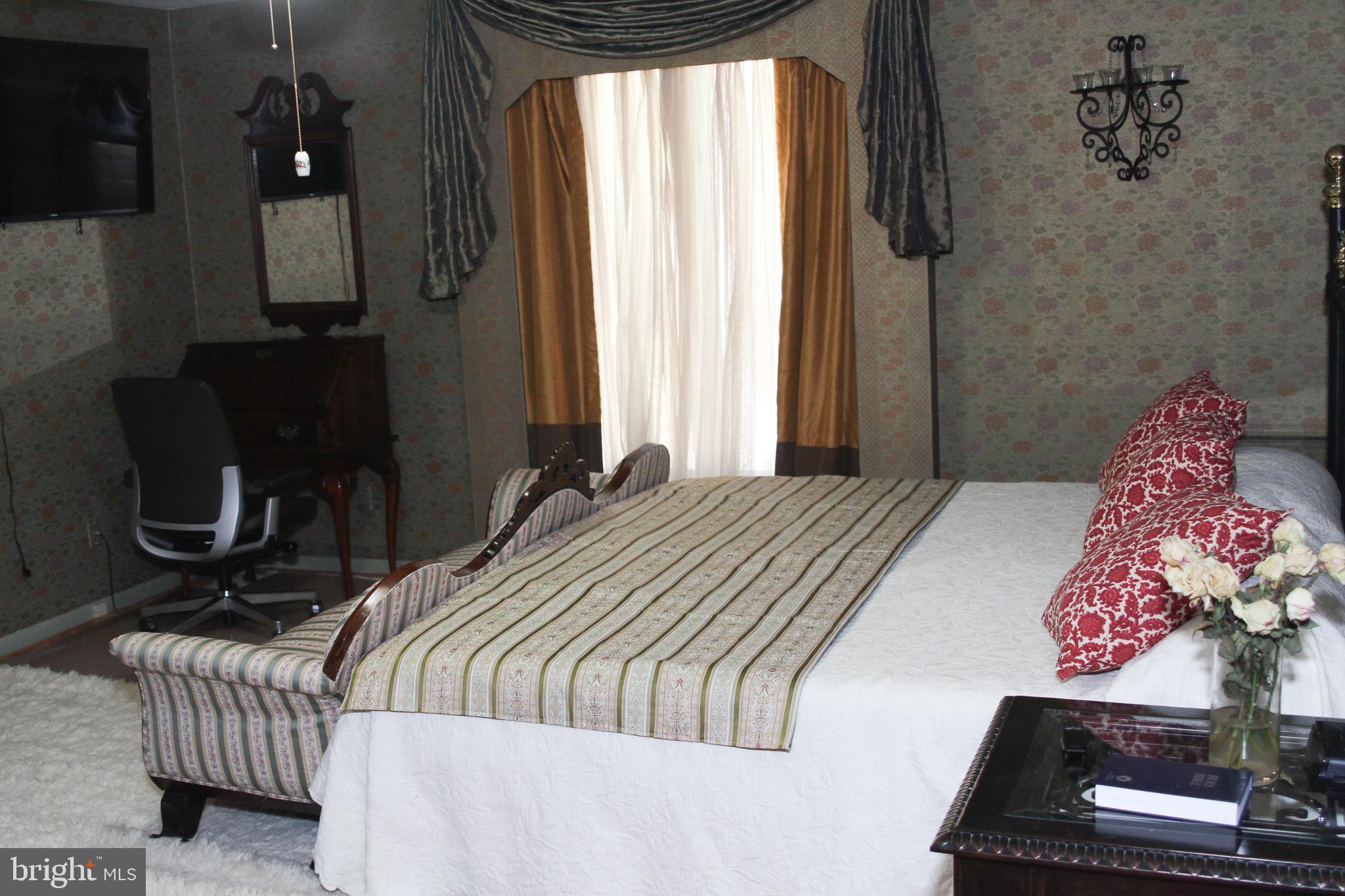 600 Glenside Road Millville, NJ 08332 - Photo 31 of 61 a bedroom with a bed and wooden floor