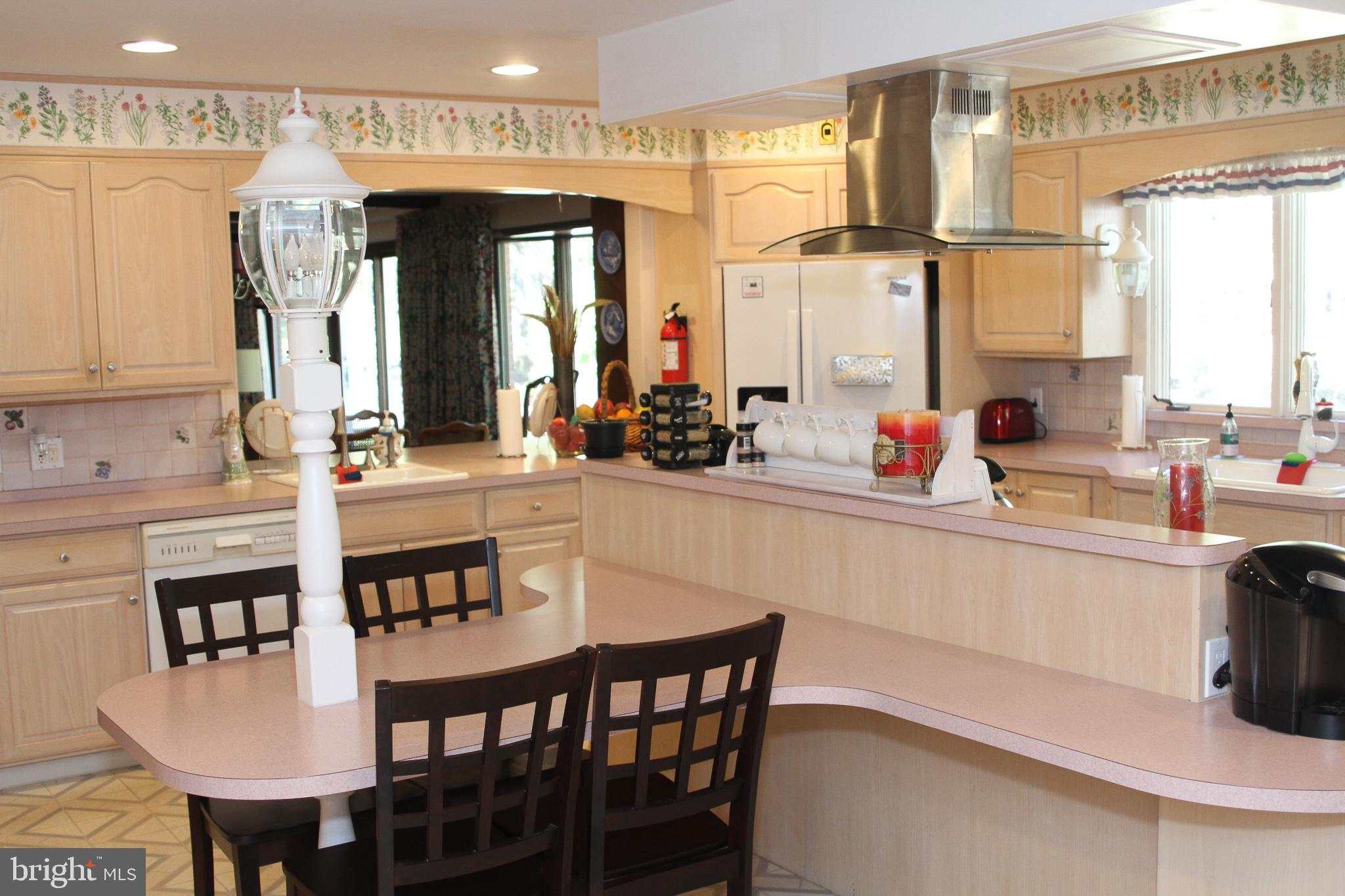 600 Glenside Road Millville, NJ 08332 - Photo 39 of 61 a kitchen with a table chairs sink and cabinets