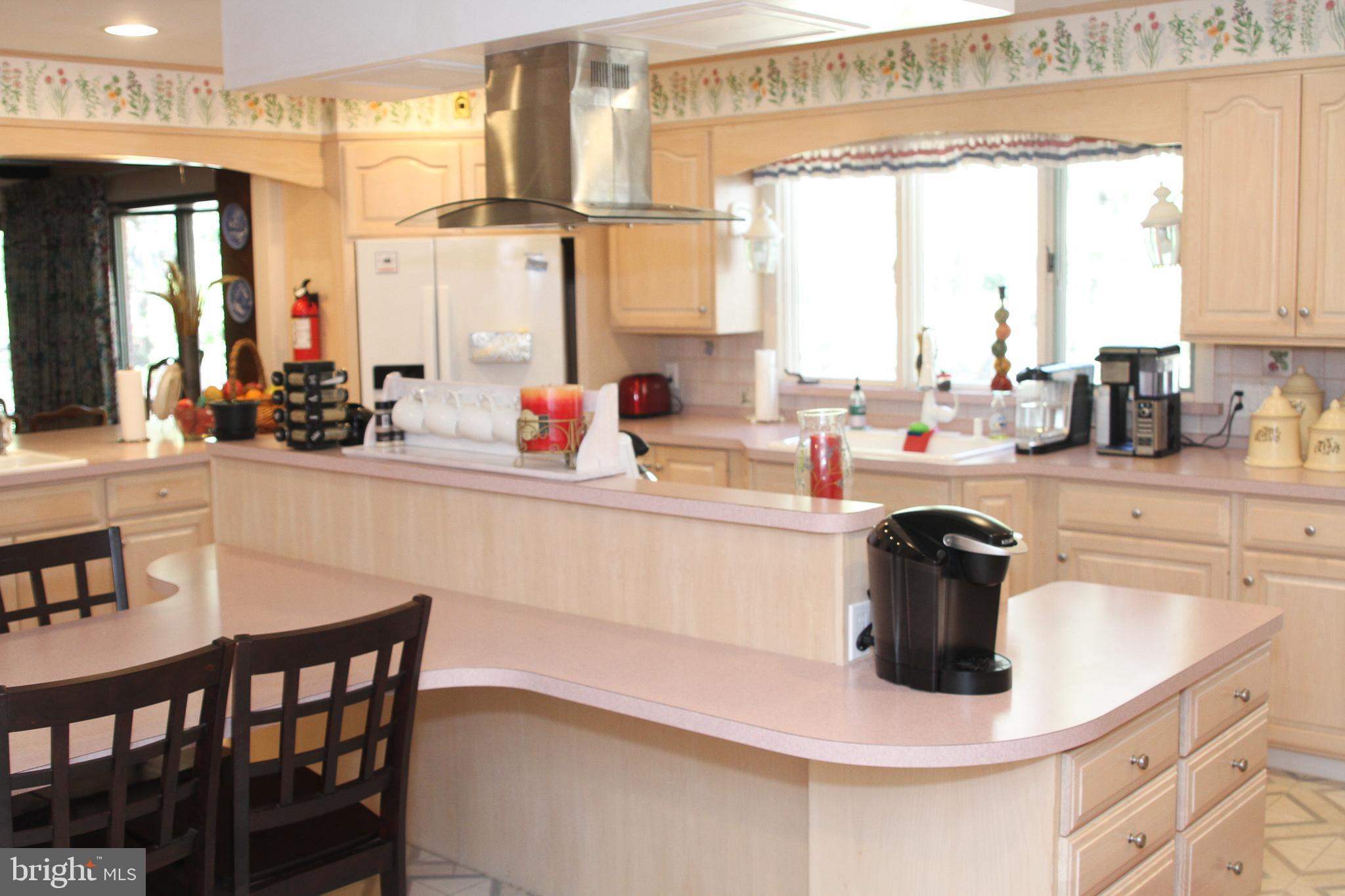 600 Glenside Road Millville, NJ 08332 - Photo 40 of 61 a dining table with a large window and chairs