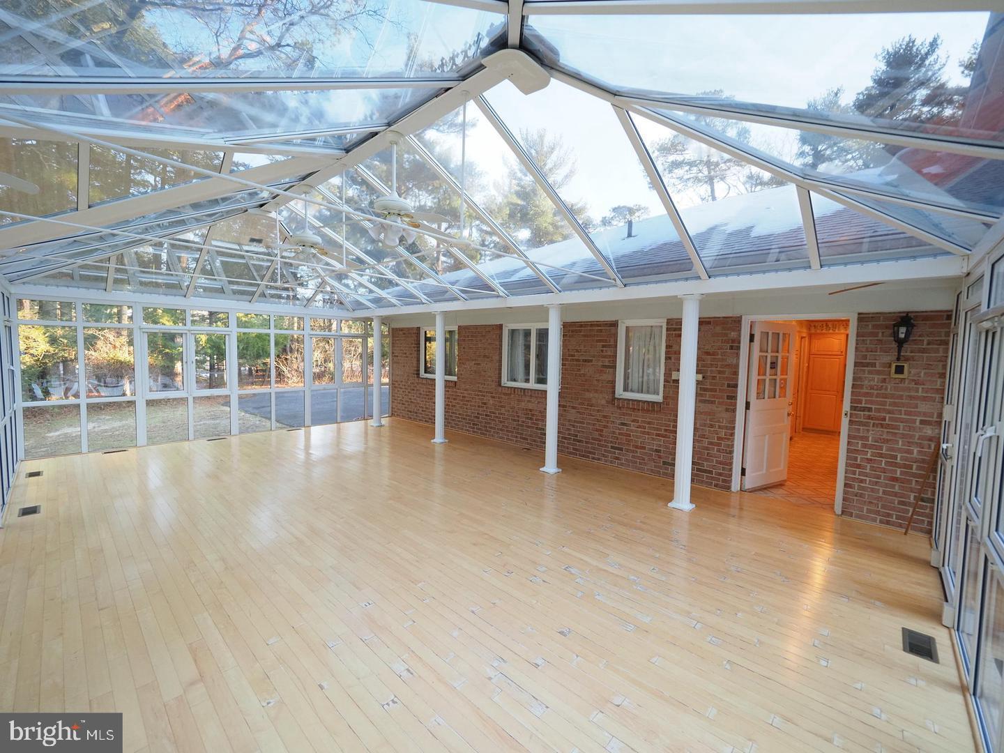 600 Glenside Road Millville, NJ 08332 - Photo 44 of 61 a view of an empty room with wooden floor and a window