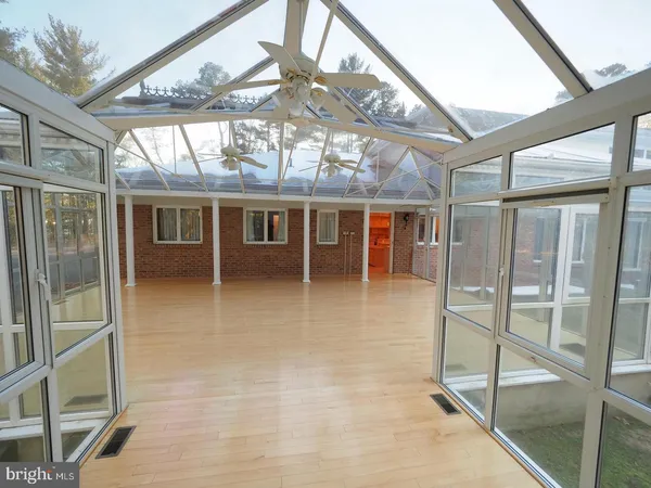a backyard of a house with a yard and outdoor seating