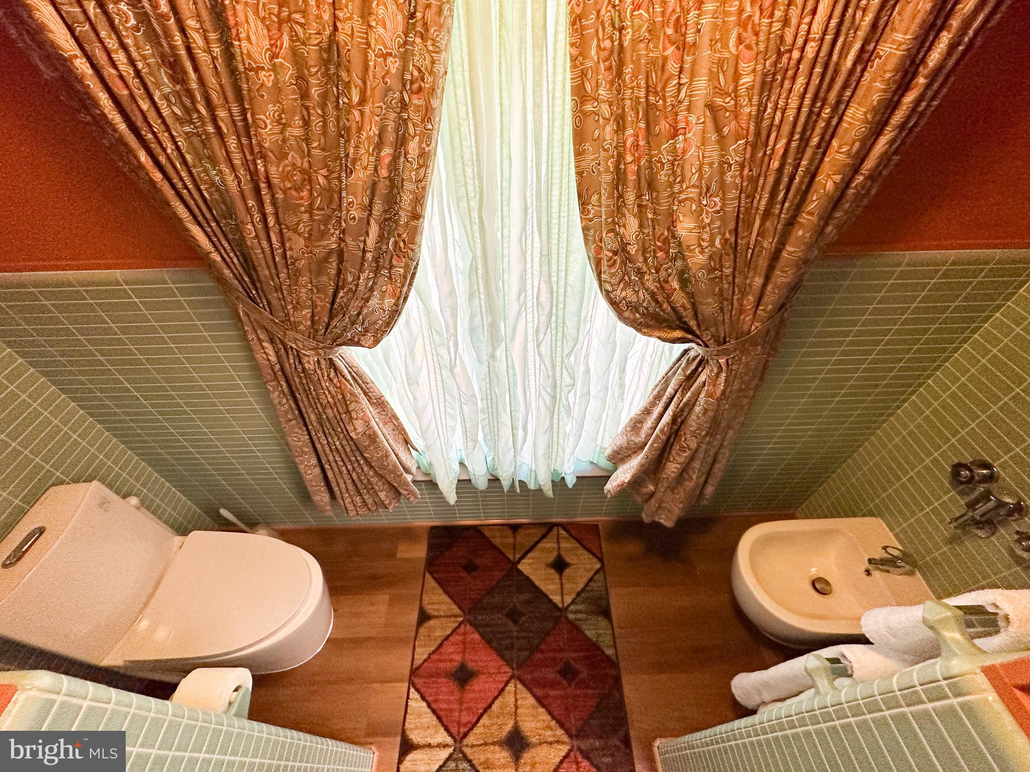 600 Glenside Road Millville, NJ 08332 - Photo 10 of 61 a bathroom with a toilet sink and mirror