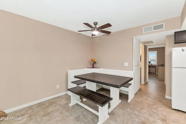 a room with pool table and a chandelier